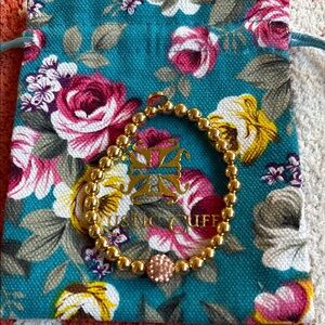 Gold Beaded Bracelet with Pink Accent